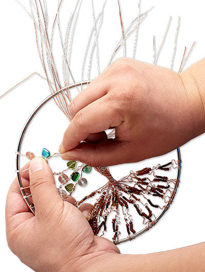 Beads being added to wire in loop
